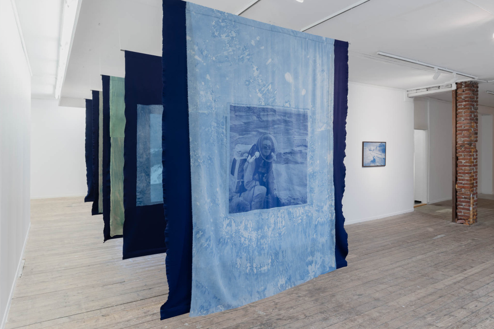 "Blowing soap bubbles into the crystal-clear sky to see them freeze and pop", five hand-dyed and screen printed textiles on steel tubes, indigo, cyanotypes, phycocyanin, acrylic paint